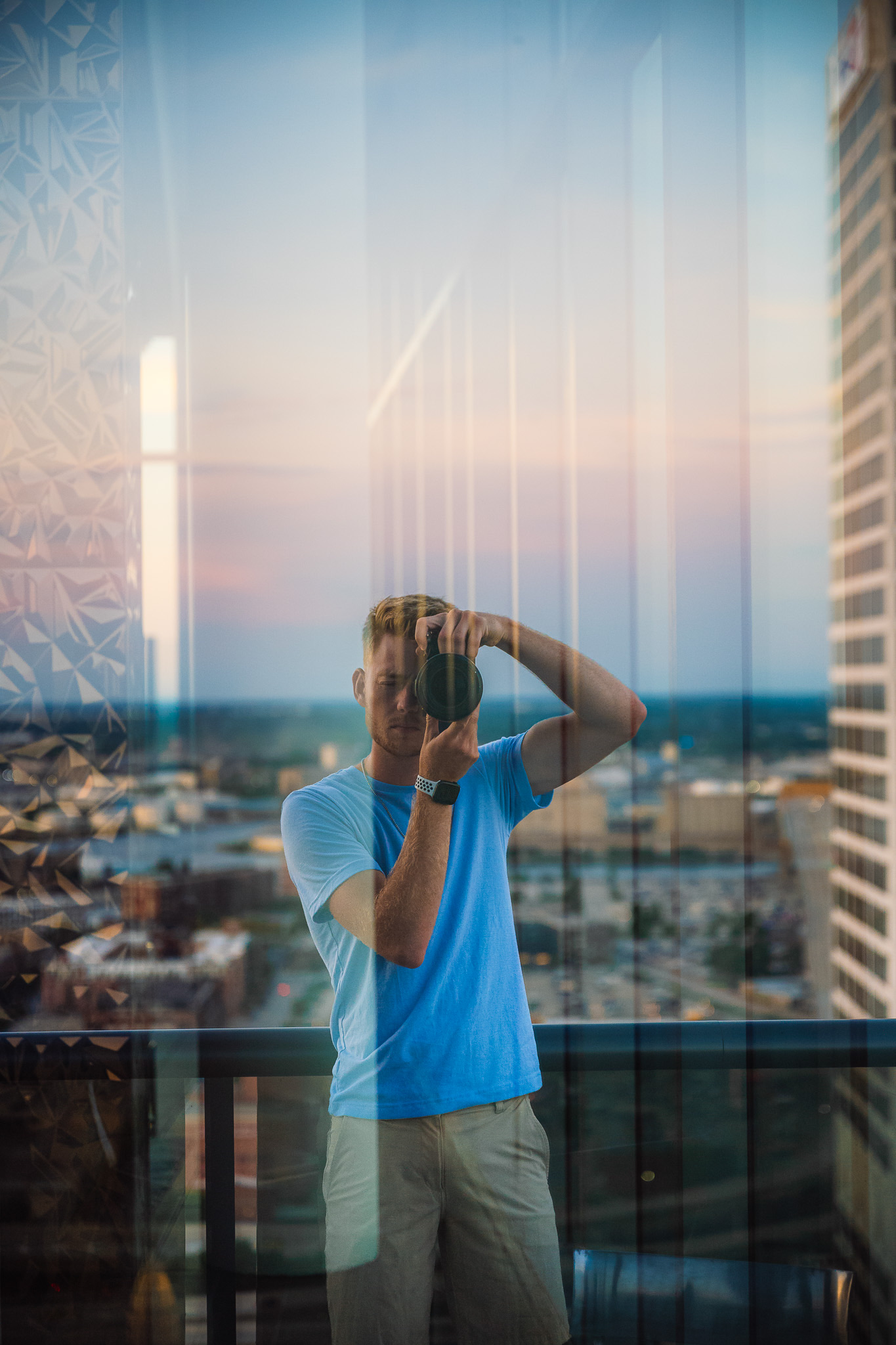 Zac photographing through glass